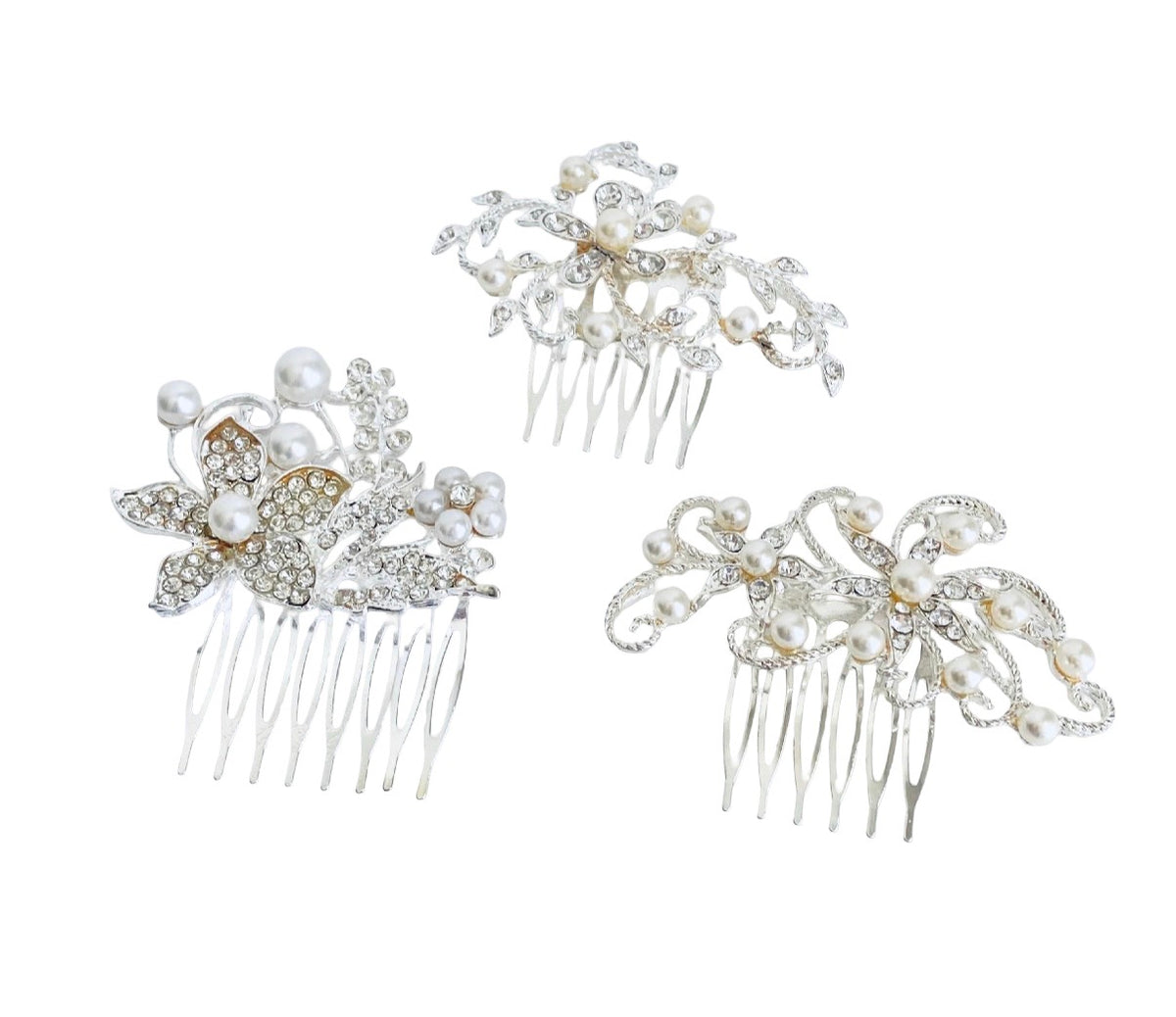 Three bridal hair combs decorated with white faux pearls, clear rhinestones, and silver-toned metal, displayed on a solid white background.