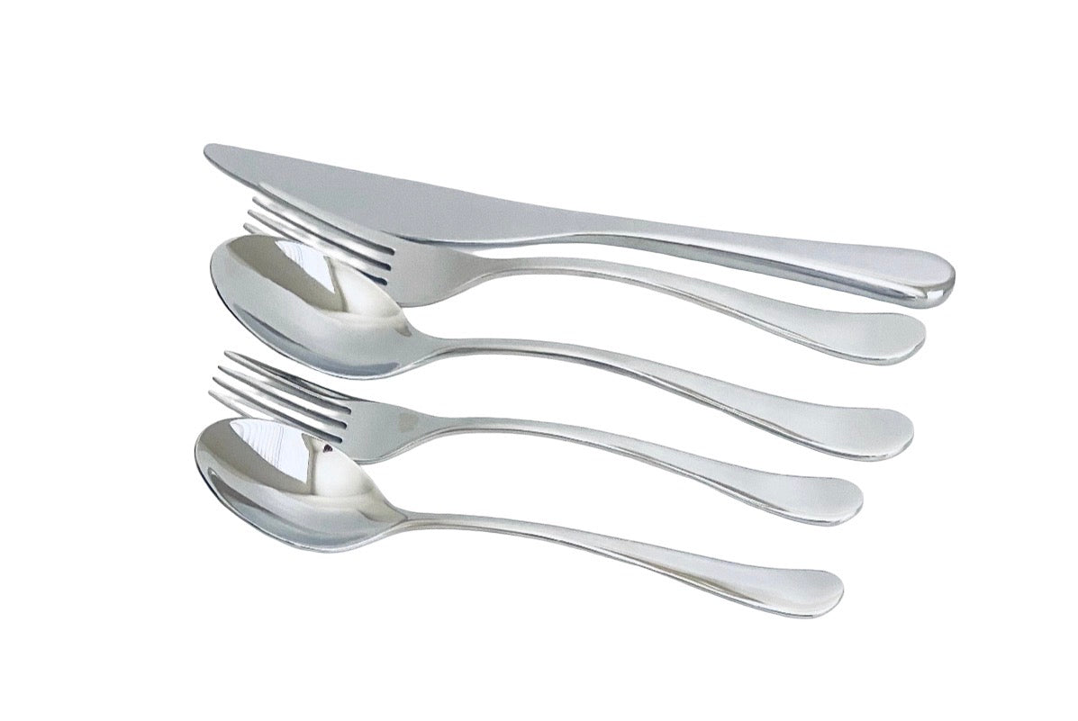 Four-piece stainless steel cutlery set with a knife, two spoons, and two forks, arranged diagonally on a plain white background.