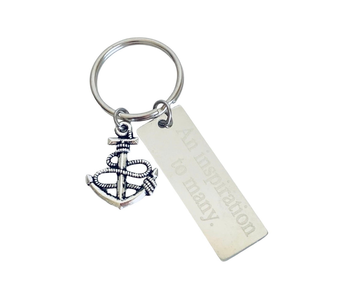 A silver-toned metal keychain featuring a detailed anchor charm wrapped in rope and a rectangular bar engraved with the phrase 'An inspiration to many.' on a plain white background.