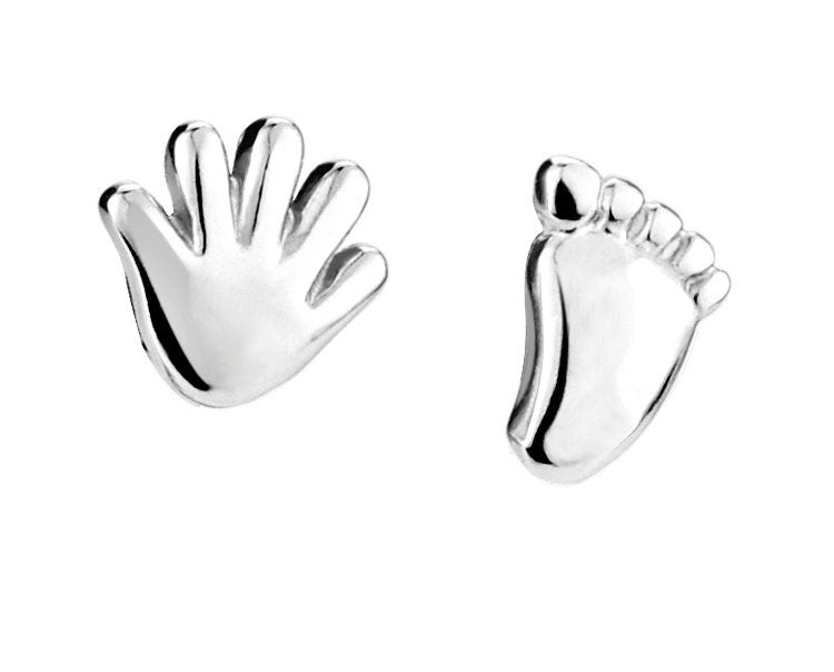 Silver hand and foot earring on a white background