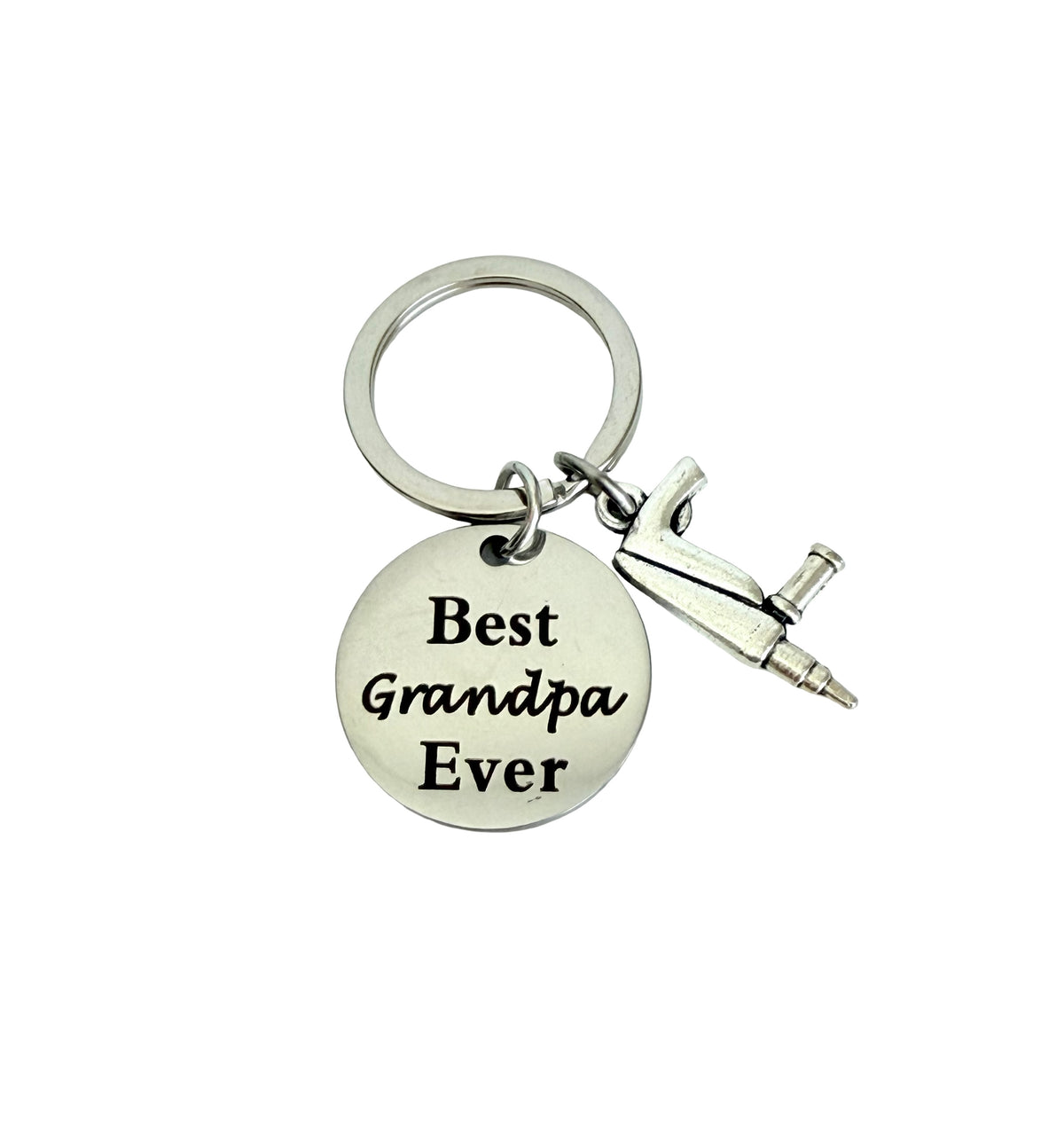 Keychain with 'Best Grandpa Ever' tag and tool charm on a white background