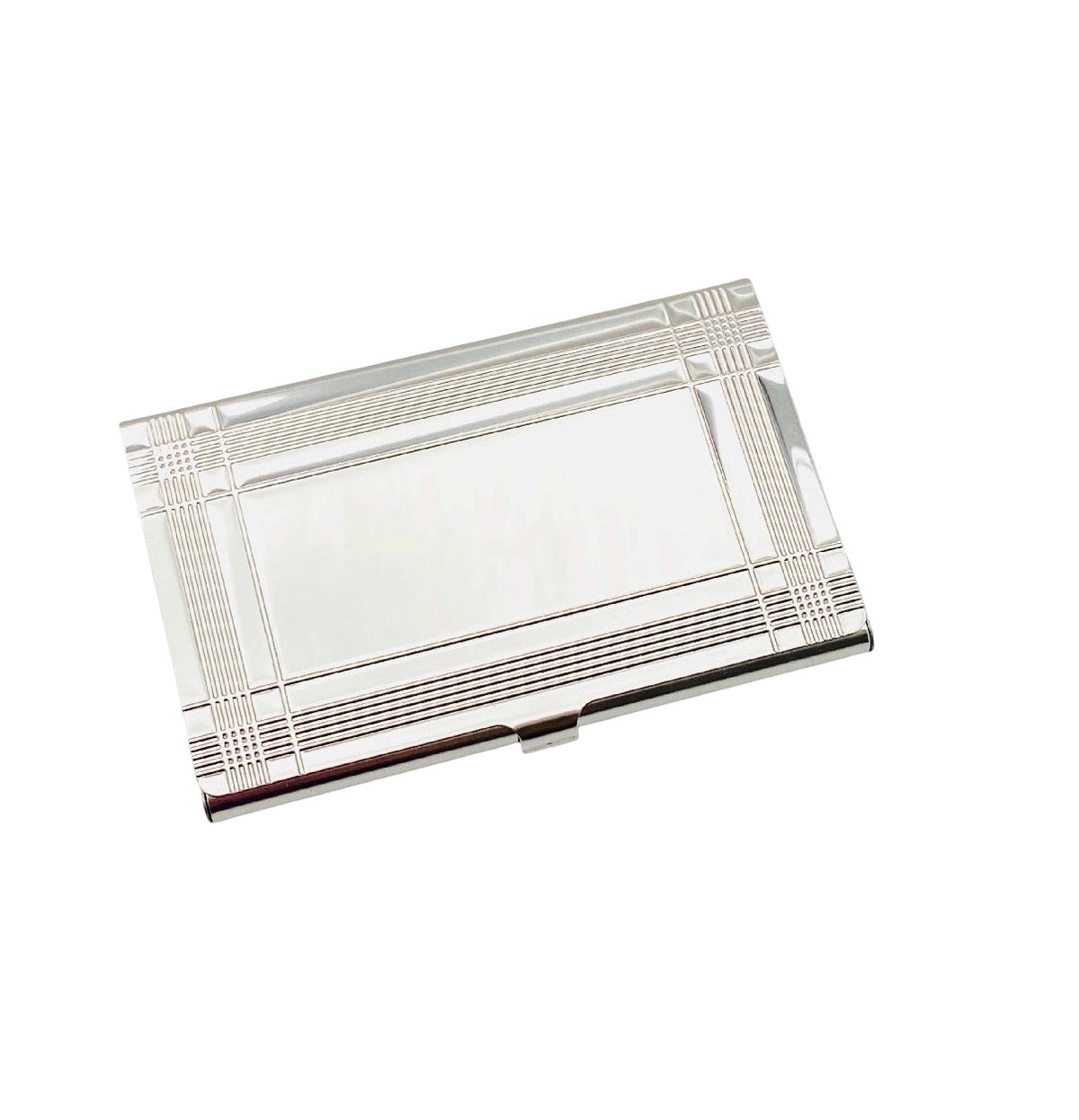 A rectangular silver metal business card case with a polished reflective surface and engraved geometric border details, shown on a plain white background.