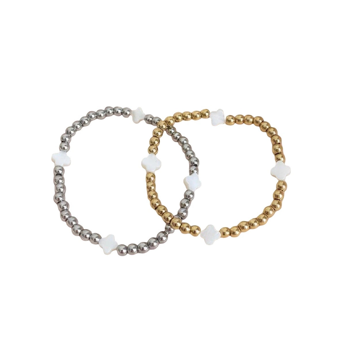 Two beaded stretch bracelets, one metallic silver and one metallic gold, each accented with small white flower-shaped beads, displayed on a clean white background.