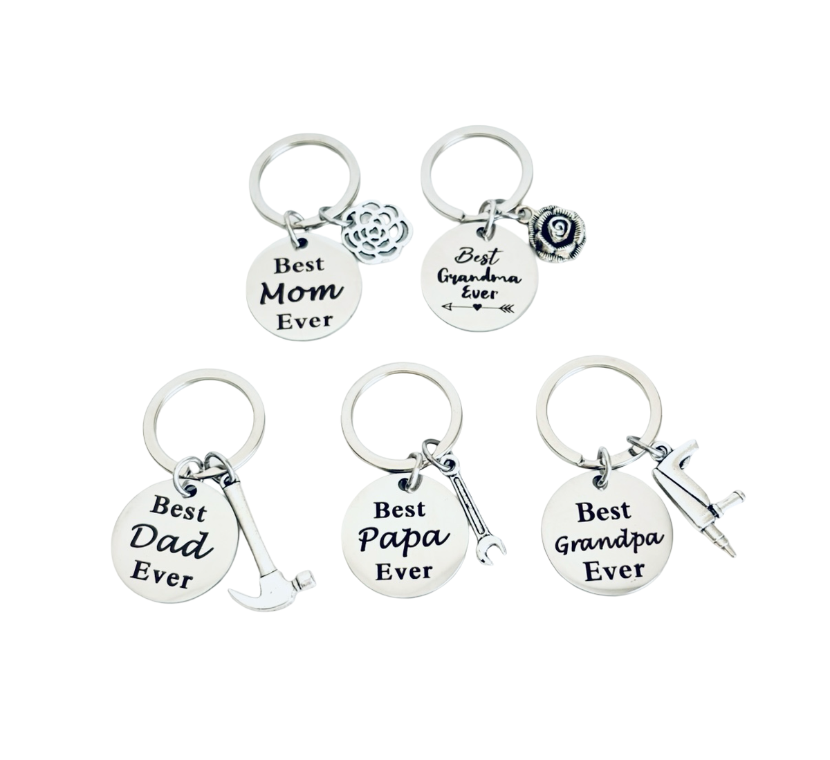 Set of five silver keychains with engraved text on a white background