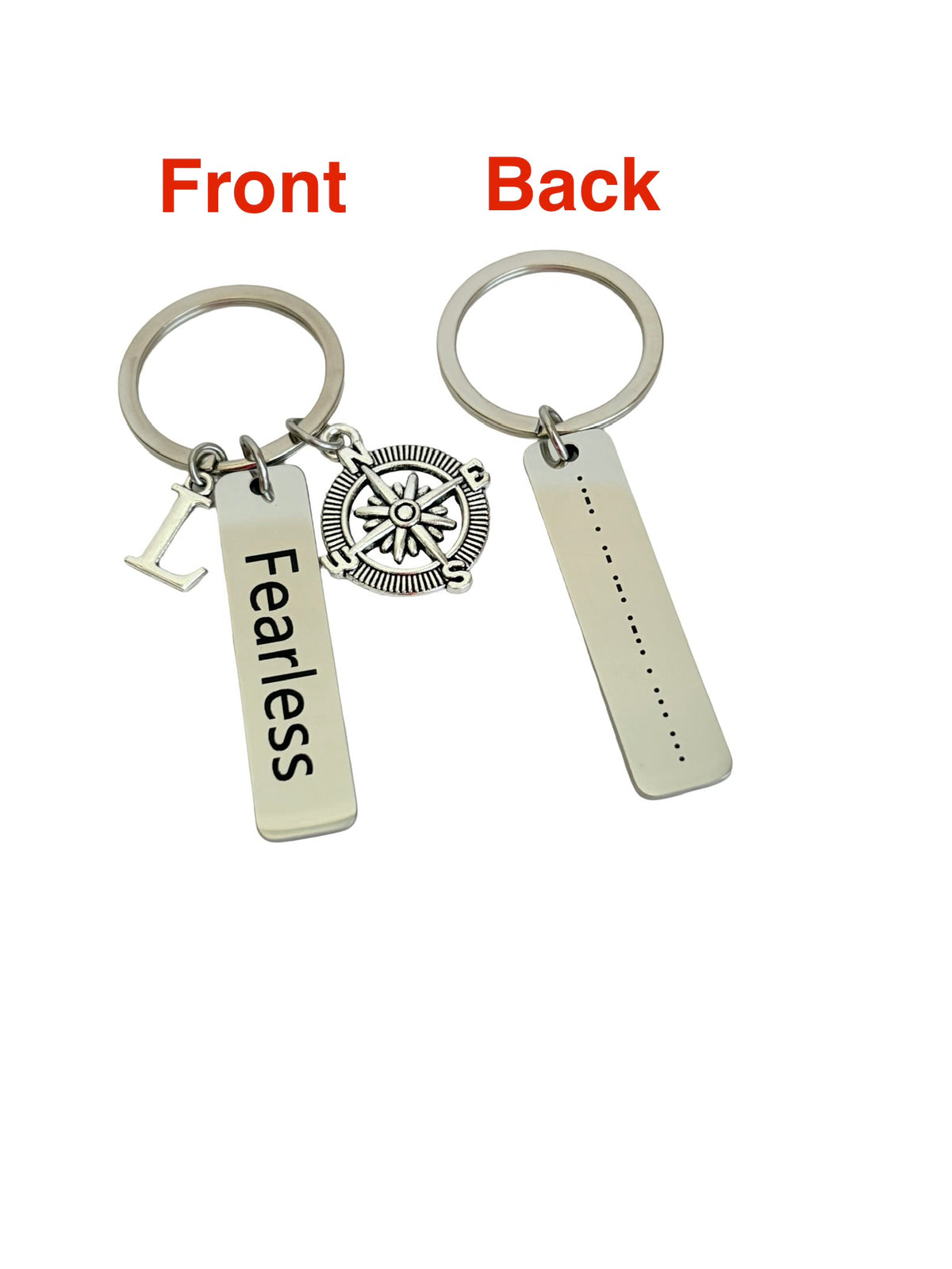 Silver keychain with 'Fearless' and compass charm on front, dot matrix design on back, on white background.