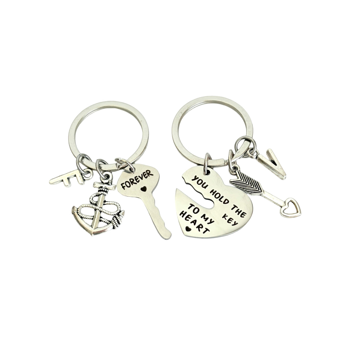 Two silver keychain sets with charms on a white background