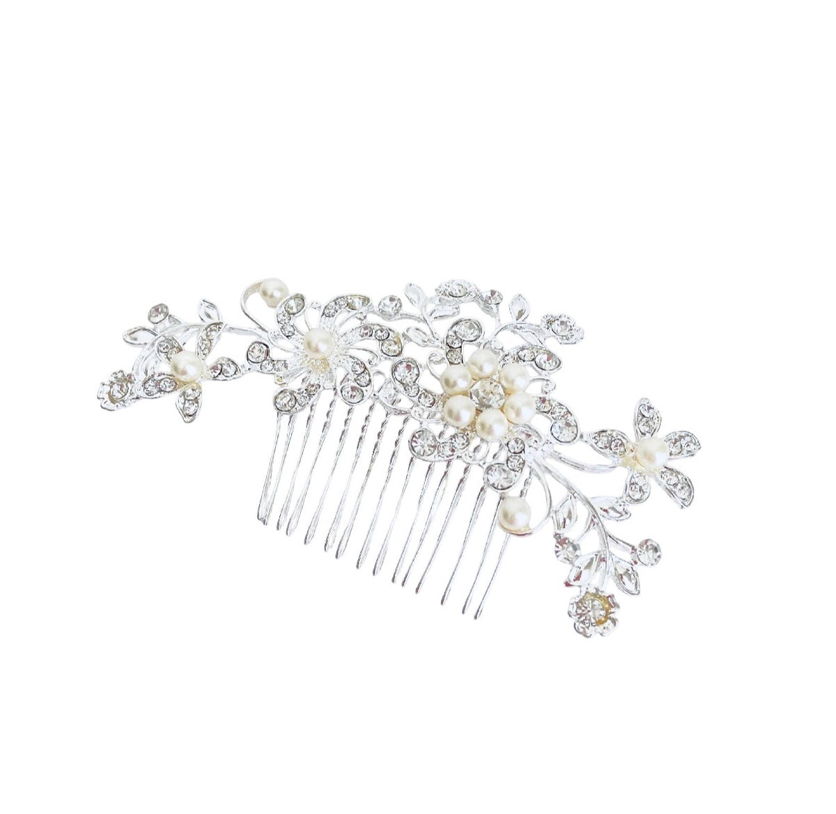 A silver floral hair comb featuring clear rhinestones and cream pearl-like flowers, set against a plain white background.