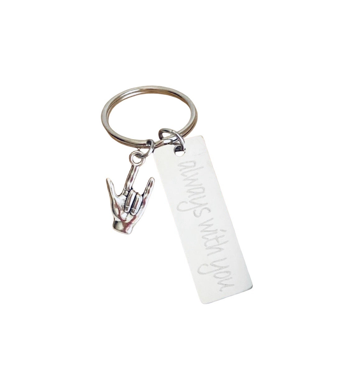 A silver metal keychain featuring a rectangular engraved tag that reads 'always with you.' and a small hand gesture charm, shown on a plain white background.