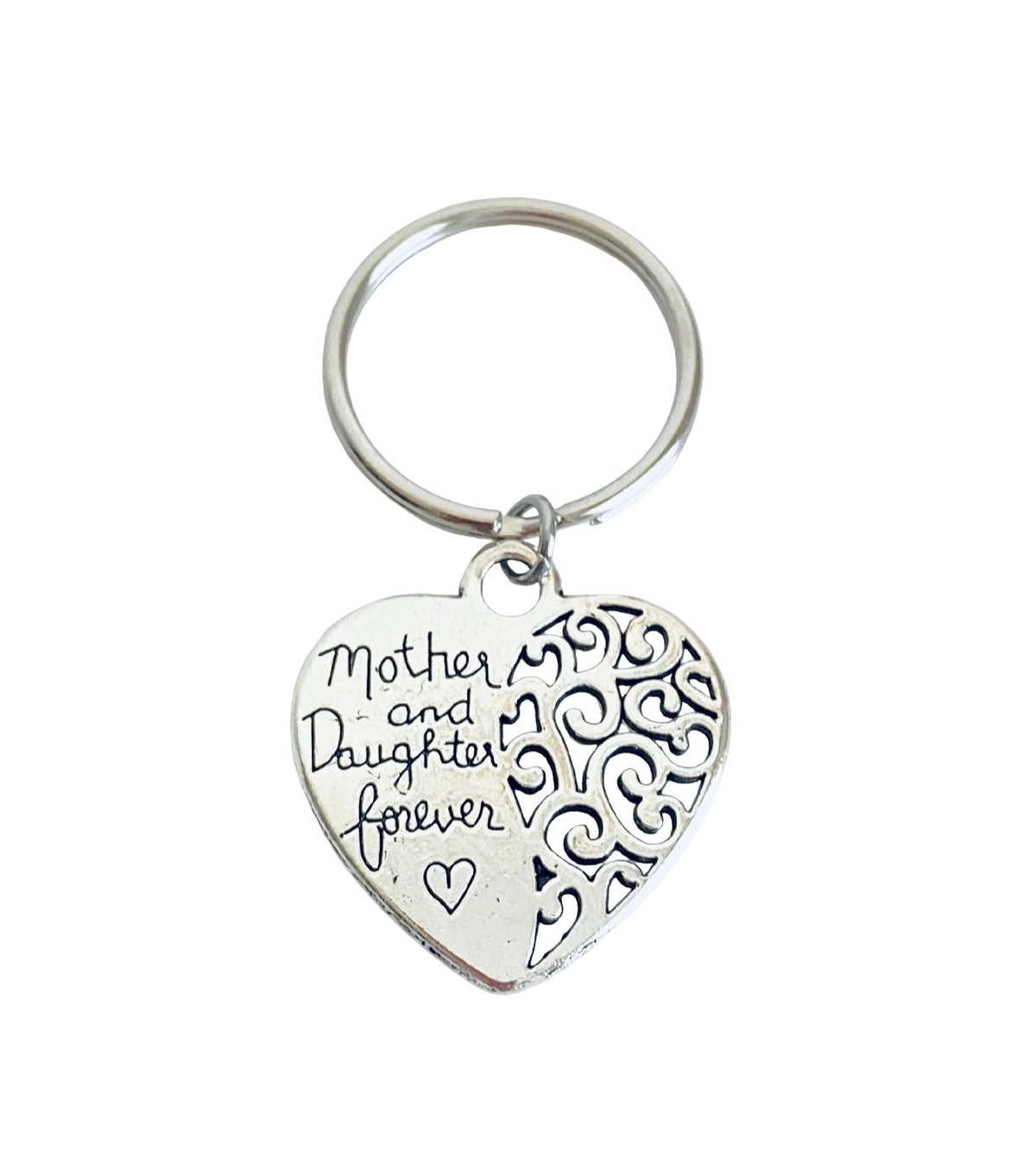 A silver heart-shaped keychain with engraved text reading 'Mother and Daughter forever' and decorative scrollwork on one side, shown on a plain white background.