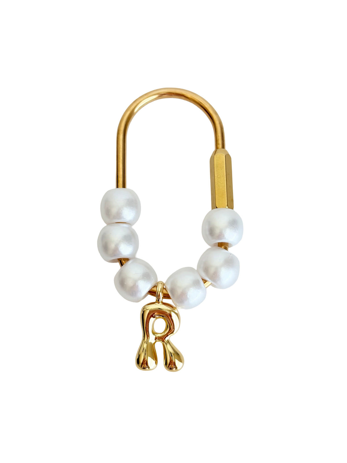 A gold safety-pin style ring with white pearl beads and a dangling gold charm, shown on a plain white background.