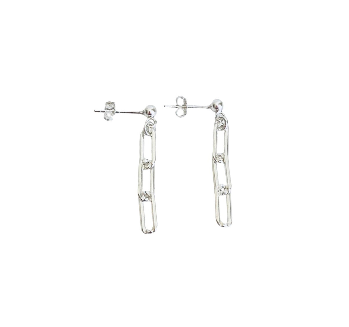 A pair of silver drop earrings with elongated paperclip-like links and small clear stones, shown on a plain white background.