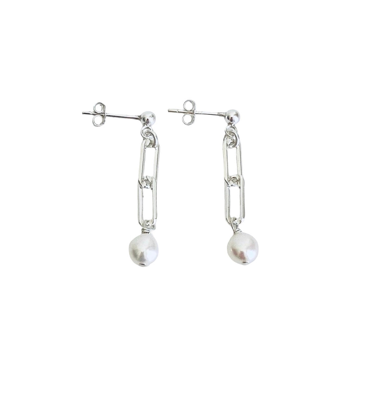 A pair of silver drop earrings featuring elongated chain-link shapes with a dangling round white pearl, shown against a plain white background.