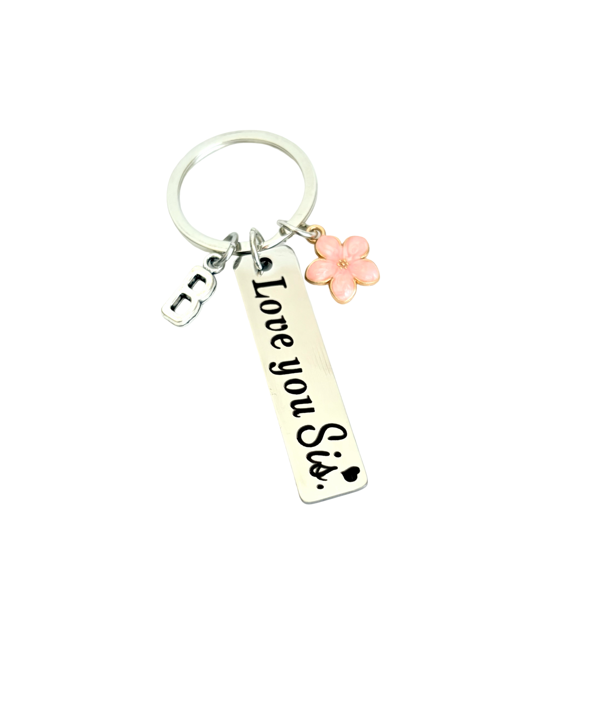 Keychain with 'Love you sis' tag and pink flower charm on a white background